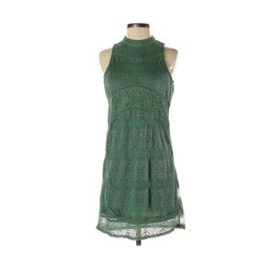 Adorable green cocktail dress for summer weddings or parties.